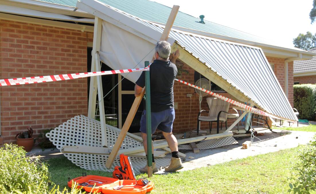 SMASHED: Her car hit a pergola before hitting another house. 