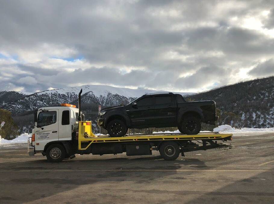 SEIZED: The ute is towed away from Falls Creek. 