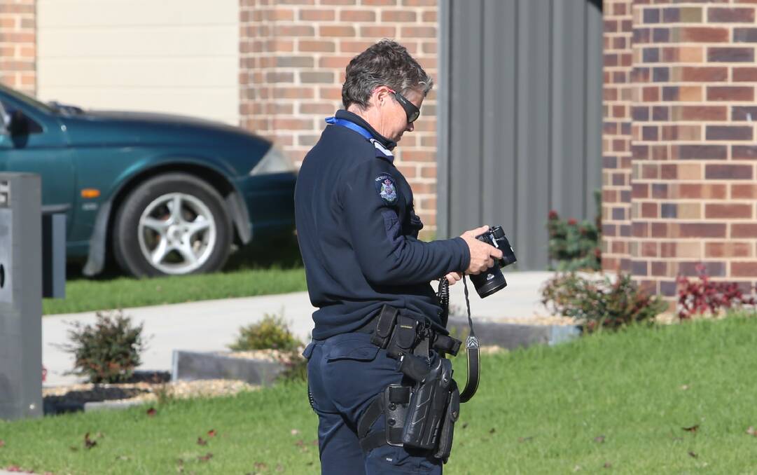 ON SCENE: Police took photos of the home after the incident. 