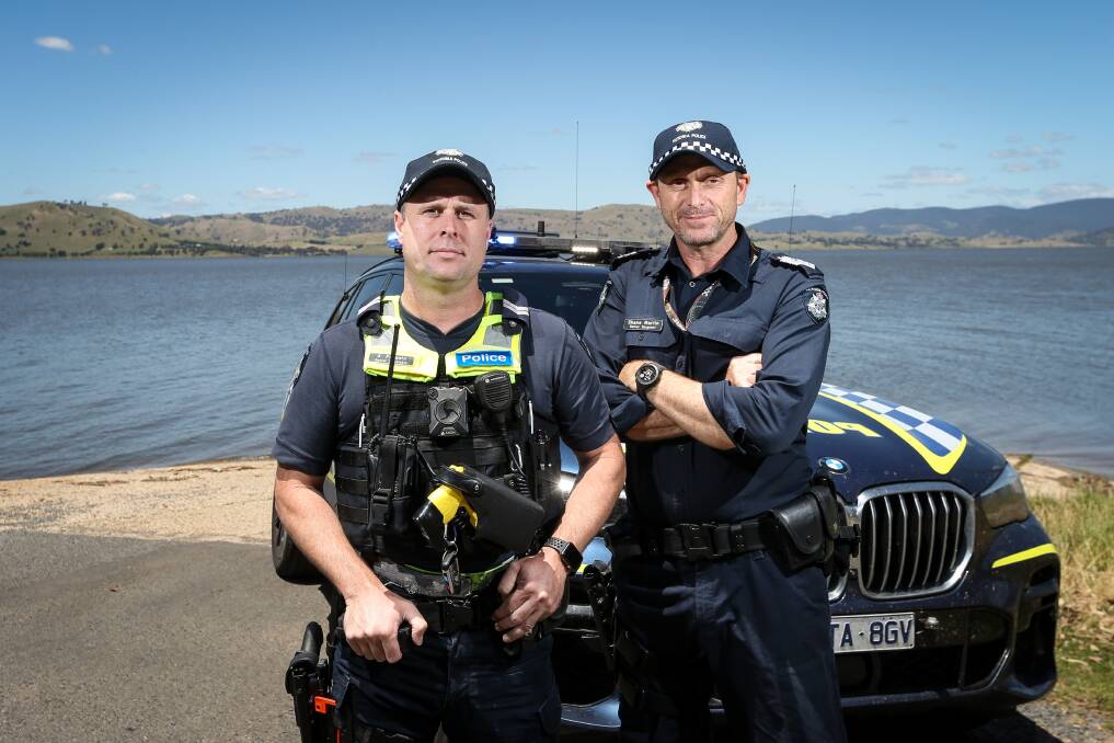 Senior Constable Adam Presutti and Senior Sergeant Shane Martin at Lake Hume. Police are urging people to boat responsibly during the summer period. Picture by James Wiltshire