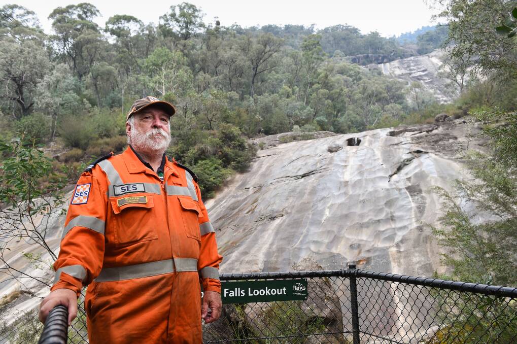 SCENE: Graham Gales of the SES says people need to follow warning signs at the falls. Picture: MARK JESSER