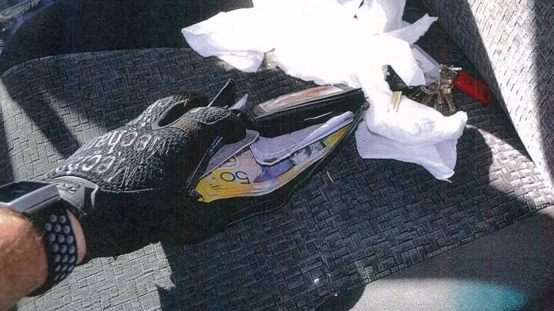 SEIZED: Police found cash inside Kenneth Wiggett's wallet in the vehicle. 