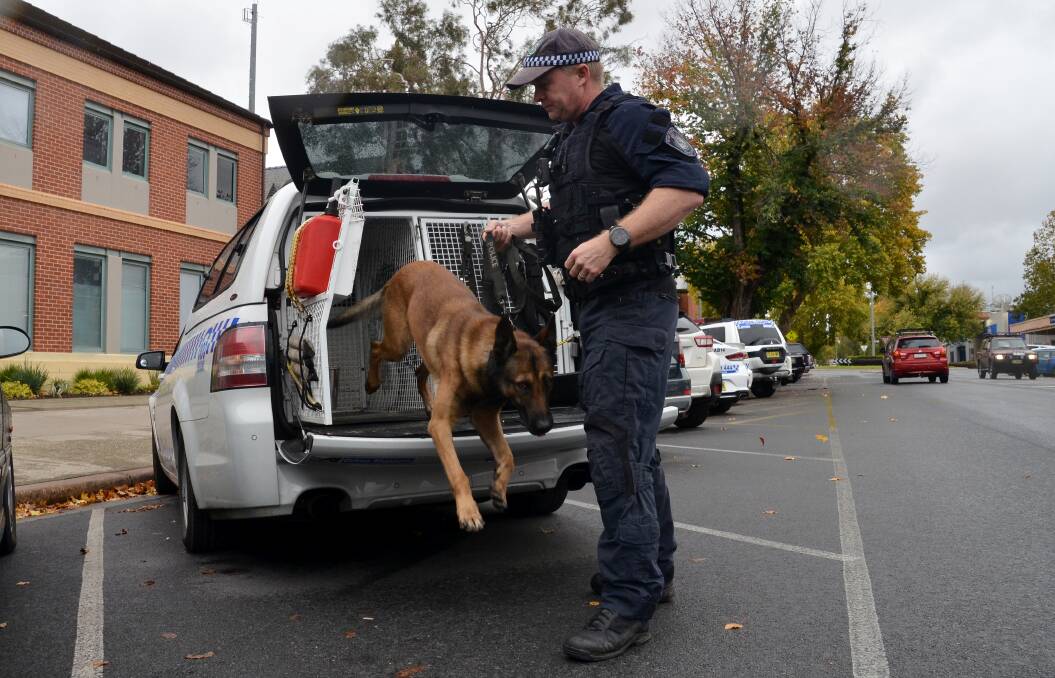 IN ACTION: Police dog Dravec and handler Senior Constable Dave Cole, pictured outside Albury Police Station on Friday. The pair have helped with a string of arrests. Picture: BLAIR THOMSON