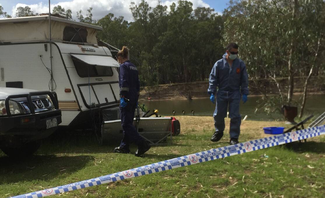 CRIME SCENE: Forensic officers at the campsite. 