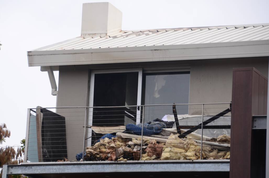DAMAGE: Burnt items could be seen outside the Albury home following the blaze on Sunday night. Firefighters spent more than three hours on the scene. 