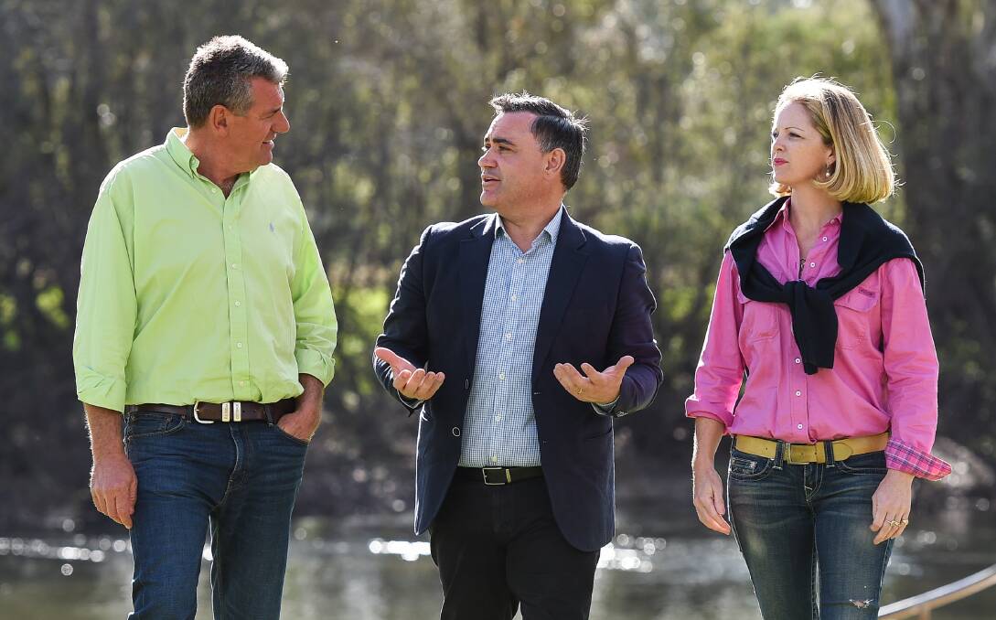 MEETING: David Dunstan and his wife Andrea meet with Deputy Premier John Barilaro, centre, at Noreuil Park in Albury on Monday afternoon. They talked about an incident at his family property. Picture: MARK JESSER
