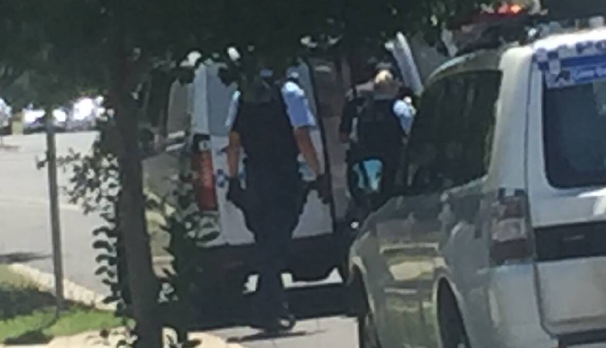 ARREST: Police speak to the man after his arrest at a Union Road home on Thursday. 