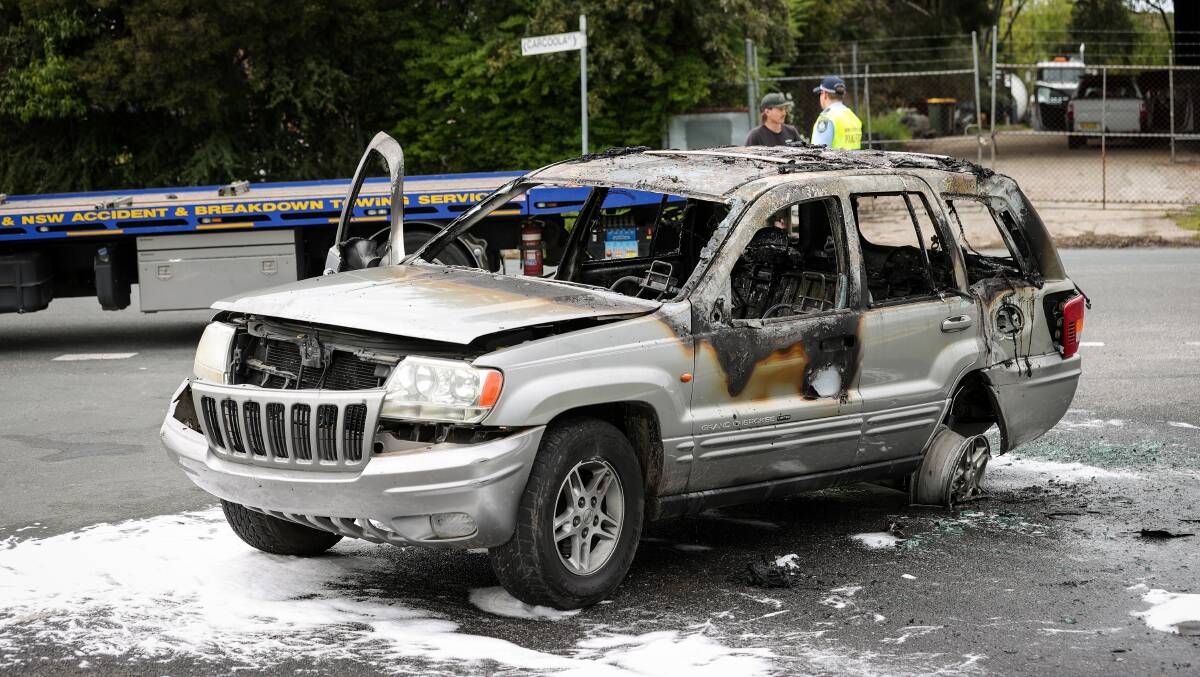 The burnt out Jeep on Tullimbar Street in North Albury on Monday morning. Picture by James Wiltshire