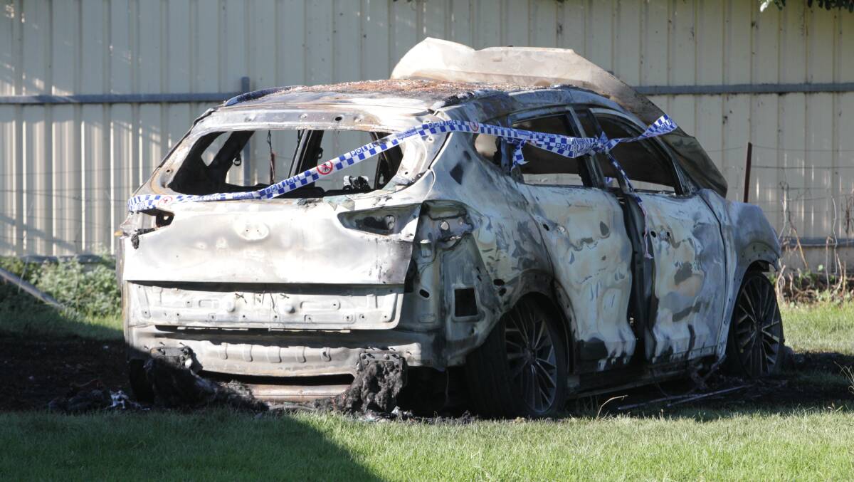 DESTROYED: The dumped vehicle at a Lavington park on Wednesday morning. Picture: BLAIR THOMSON