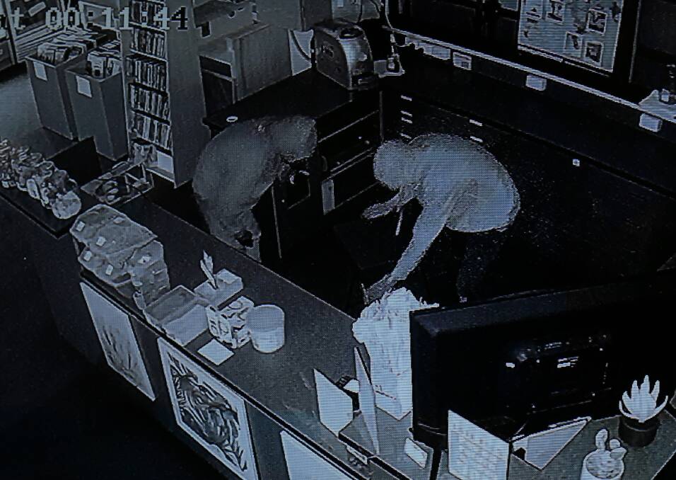 WANTED: Police are trying to identify this pair of sock wearing bandits. 