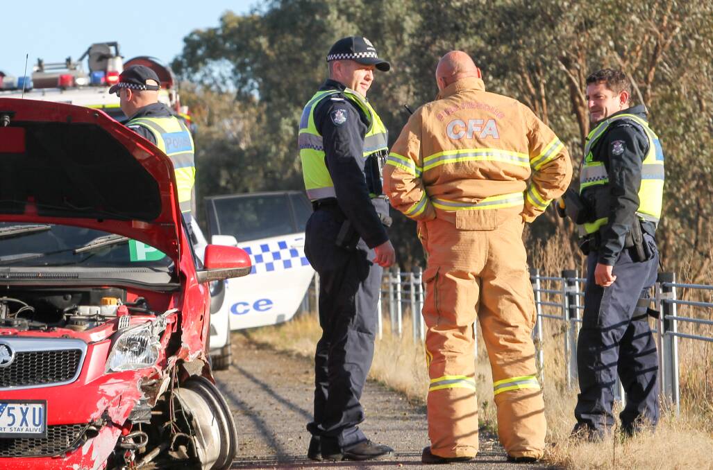 STRUCK: A Holden avoided travelling down an embankment after hitting the barriers in July.  