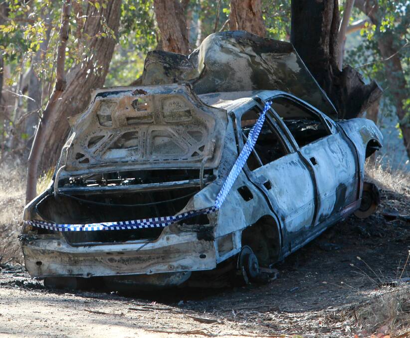 BURNT OUT: A destroyed Peugeot on Friday morning. Picture: BLAIR THOMSON