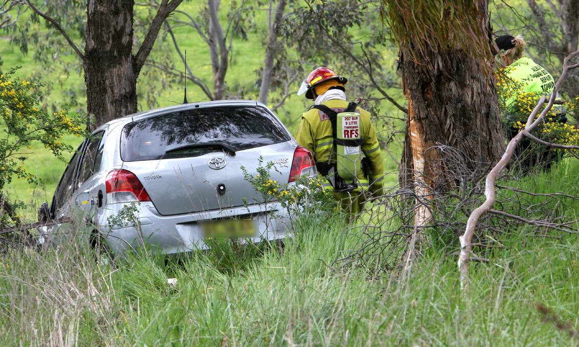 CRASH: A firefighter at the scene of the crash on Thursday. Pictures: BLAIR THOMSON