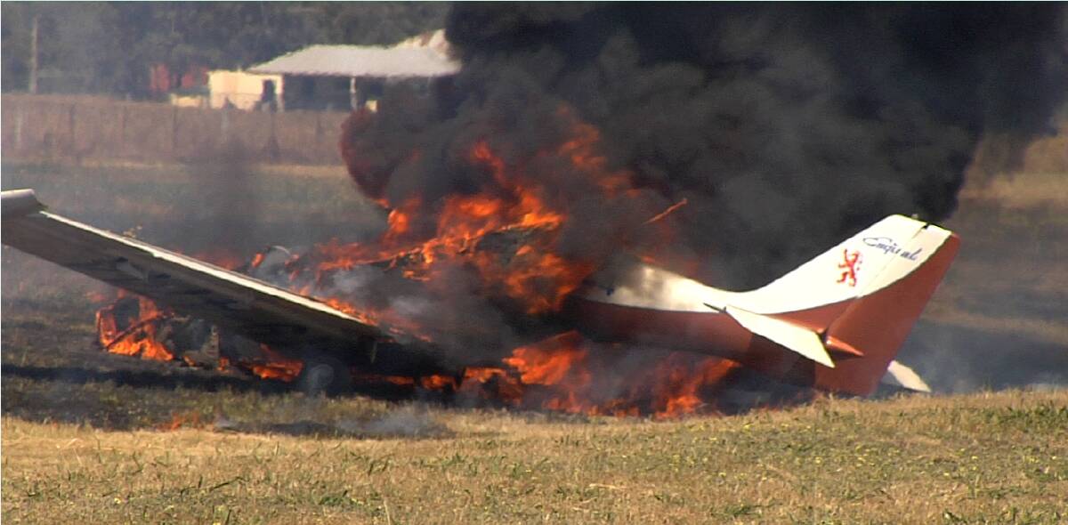INCINERATED: Flames engulf the plane at Wangaratta airport. Picture: ADRIAN VAUGHAN