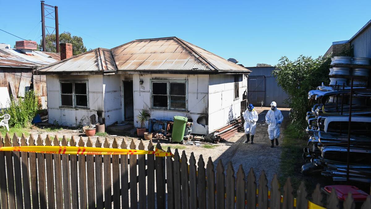 ON SCENE: Forensic investigators at the property. Picture: MARK JESSER