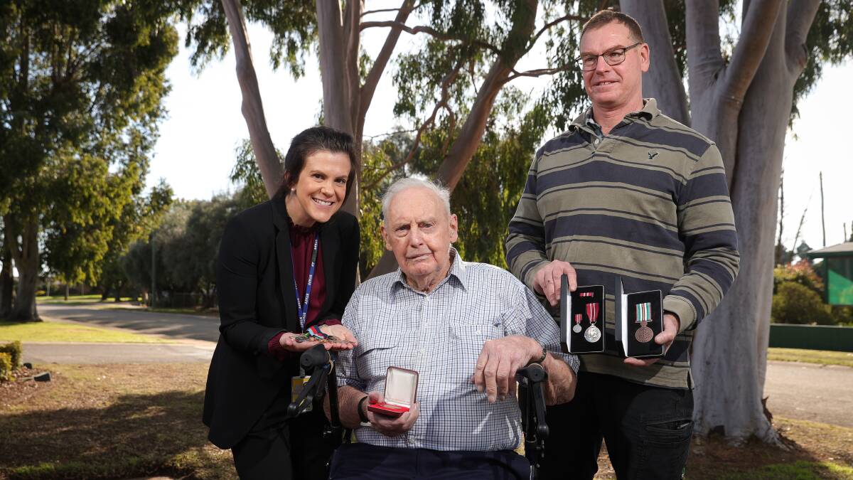 GREAT RESULT: Detective Brianna Gibson returns Max Dempster's national service medal and his family members' medals following a theft. His son, Arthur, was shocked when told they'd been found. Picture: JAMES WILTSHIRE