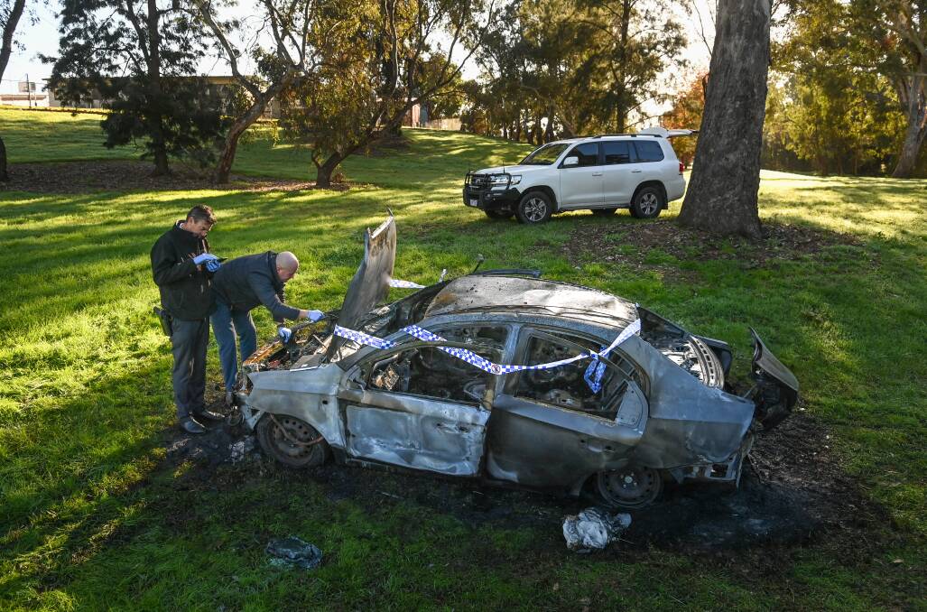 EXAMINATION: Police attended the scene of the vehicle fire in Gerard Moylan Park and are seeking information about the vehicle. Picture: MARK JESSER