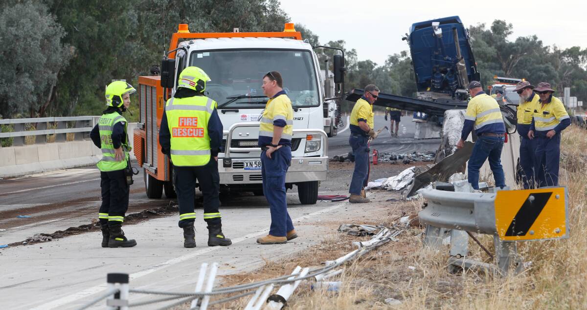 AFTERMATH: Jamie William Egan's blue Kenworth truck, owned by a Werribee transport company, came to a stop on the Hume Highway at Mullengandra after the crash. The incident caused significant damage. 