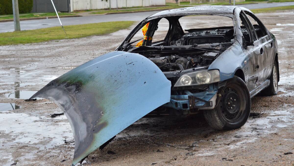 TORCHED: The suspect vehicle on Wednesday morning. Picture: BLAIR THOMSON