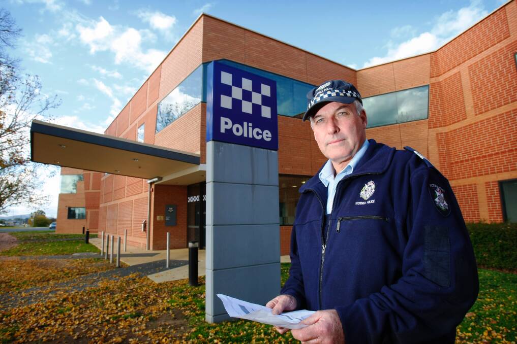 MISSED: Tributes are flowing for retired Senior Sergeant Garry Corcoran, pictured outside the Wodonga Police Station in 2009. 