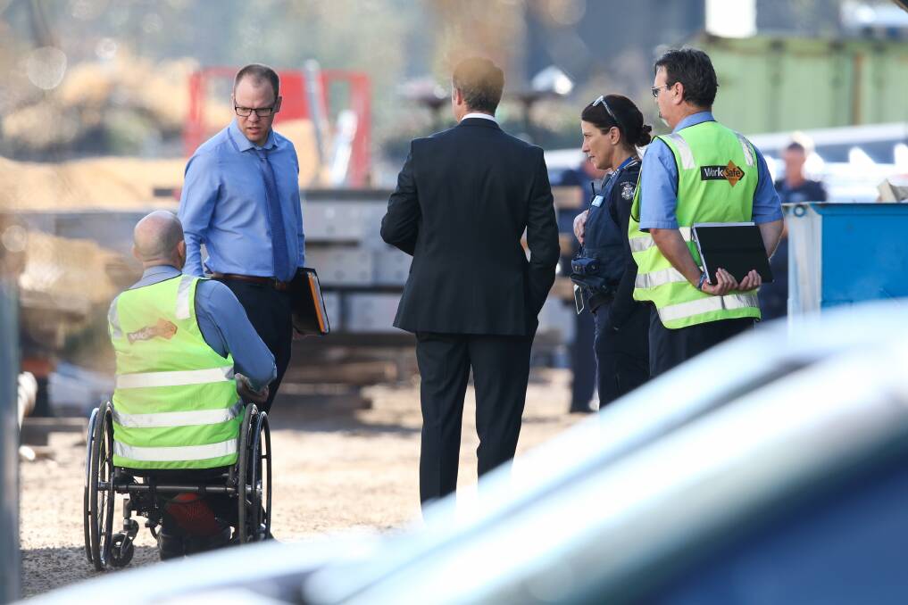 ON SCENE: Police and WorkSafe employees at the Wodonga business. 