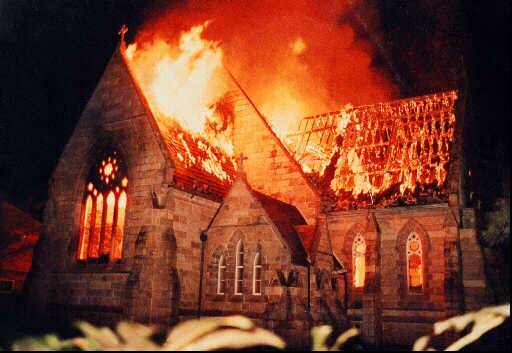 ALIGHT: St Matthew's Church on fire in 1994. 