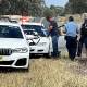 Police search a car on the Riverina Highway at Bungowannah, about 16 kilometres outside of Albury, on Wednesday morning. Picture by @jacstanley7/Seven News