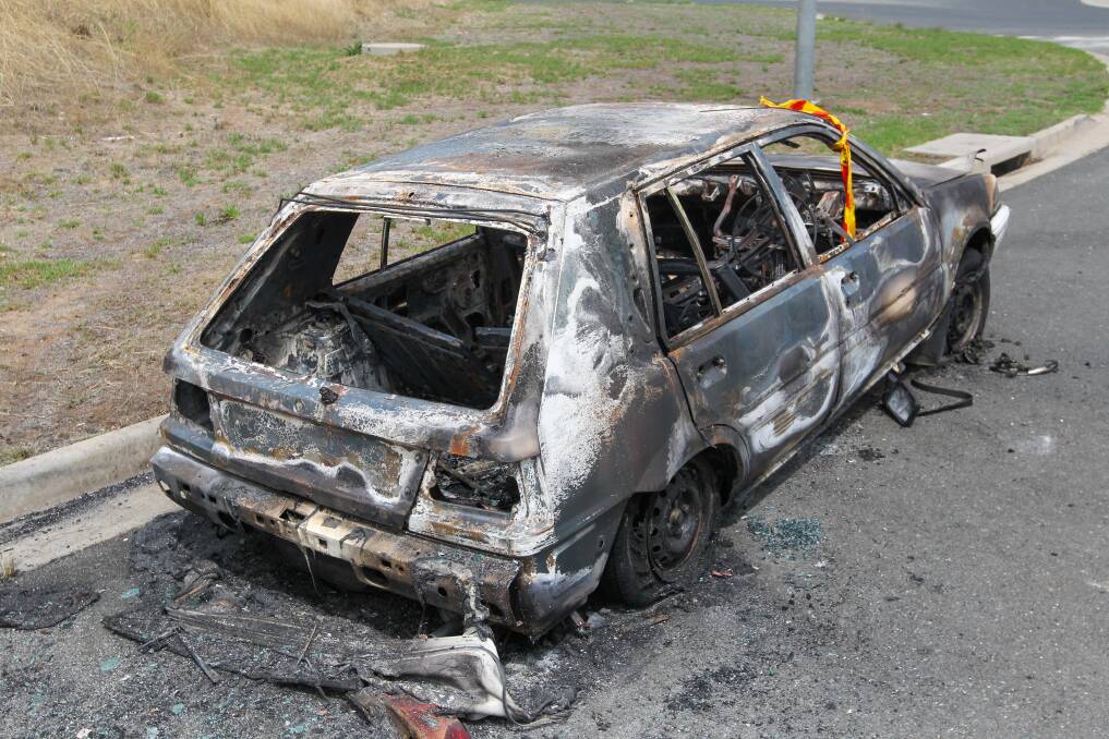 TORCHED: There was little left of the 1991 Nissan hatchback after it was set on fire off Urana Road in the early hours of Friday morning. Picture: BLAIR THOMSON