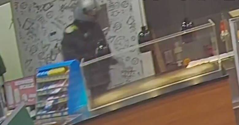 ARMED: CCTV from the Wodonga service station in the early hours of Saturday morning, which occurred a short time before a similar incident in Lavington. 