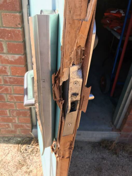 DAMAGE: A broken door at the premises. 