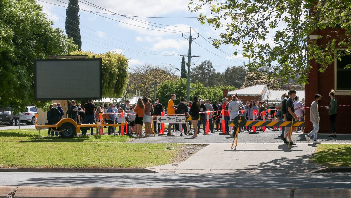 TESTING PUSH: People lined up at the Lavington testing site on Sunday. Picture: TARA TREWHELLA