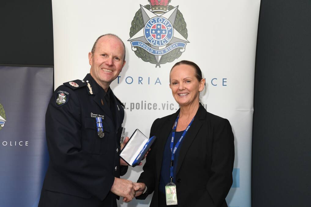 Assistant Commissioner Barrett with police public service employee Amanda Harris, who has served 10 years in the job. Picture supplied