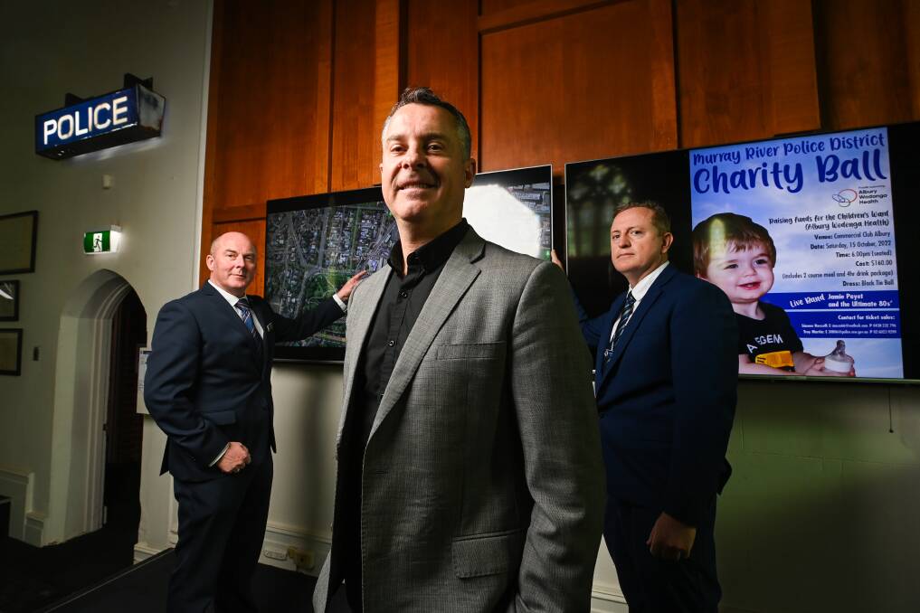 HOST: Graeme Simpfendorfer, pictured in a recreation of the Hunted TV show with Albury police members Paul Smith and Troy Martin, is throwing his support behind an Albury Wodonga Health fundraiser. Picture: MARK JESSER