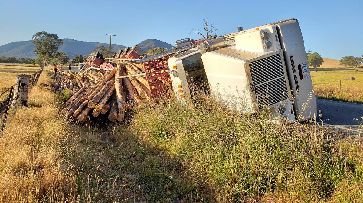TIPPED: This log truck rollover, which occurred Thursday morning, was one of several crashes to occur in recent days. Picture: SES. 