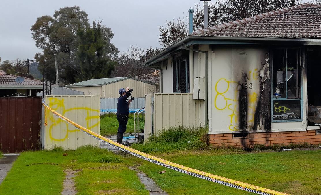 ON SCENE: A police investigator at the site on Thursday. Picture: BLAIR THOMSON