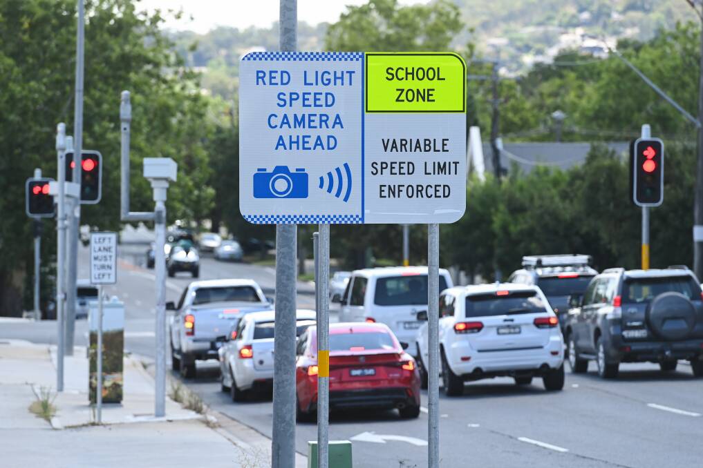 SITE: Signage leading up to the speed and red light camera in Albury. 