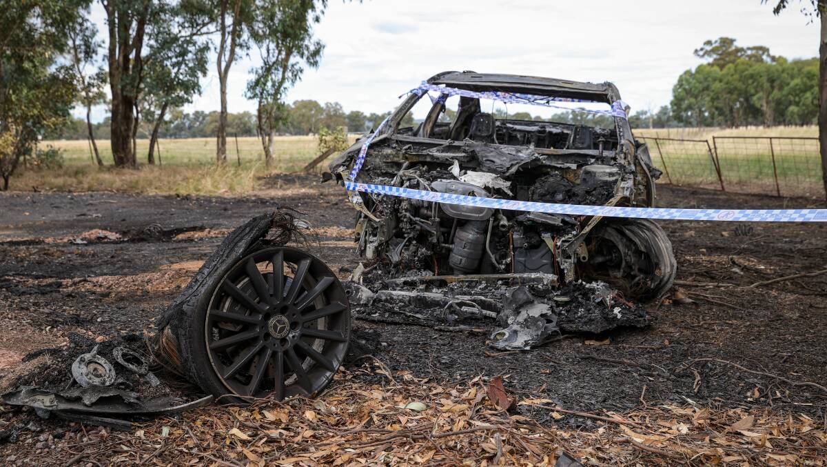 DUMPED AND GUTTED: Police were called to a blaze that destroyed a Mercedes near Barnawartha on Tuesday. The driver fled the scene. Picture: JAMES WILTSHIRE
