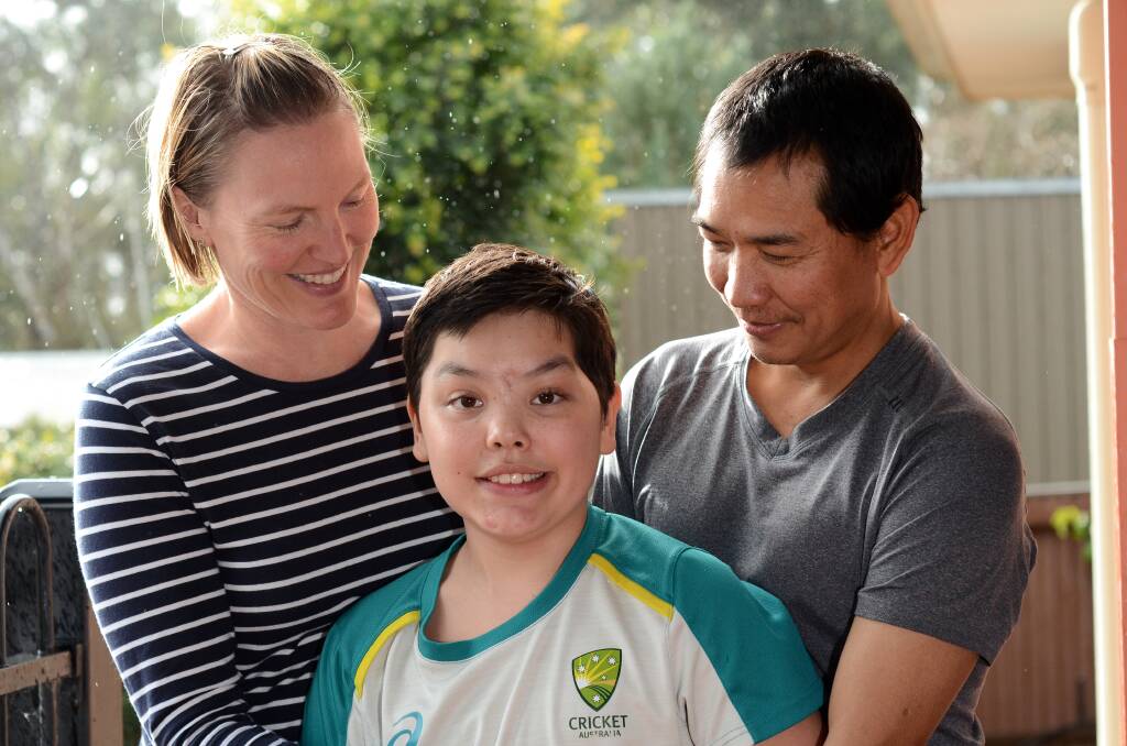 HOME: Dash Gurung, pictured with his parents Joanna and Dupendra at their Thurgoona home on Friday following a marathon stint in hospital. The family thanked everyone who had helped since the accident. Picture: BLAIR THOMSON