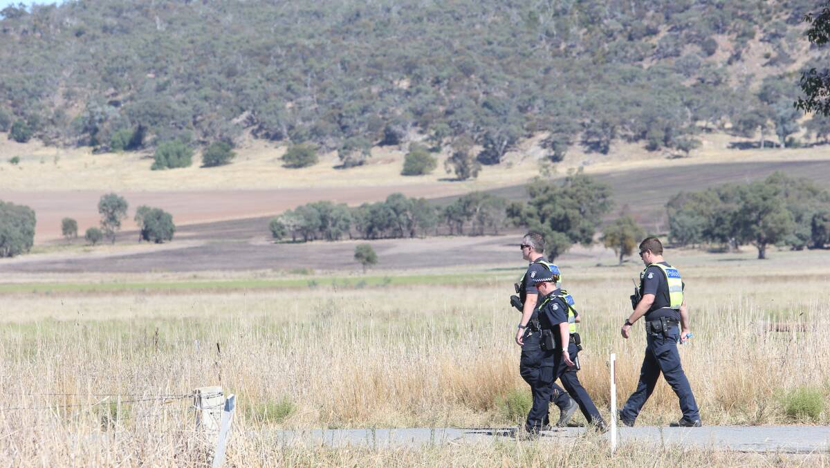 Police on Glenrowan-Boweya Road, near Hoystead Road, after Thursday morning's fatal crash. Picture by Blair Thomson