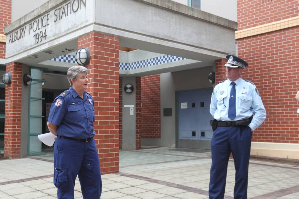 SAFETY: Superintendent Liesa Huggins and Superintendent Paul Smith discuss the abuse faced by frontline workers outside Albury Police Station. Picture: BLAIR THOMSON