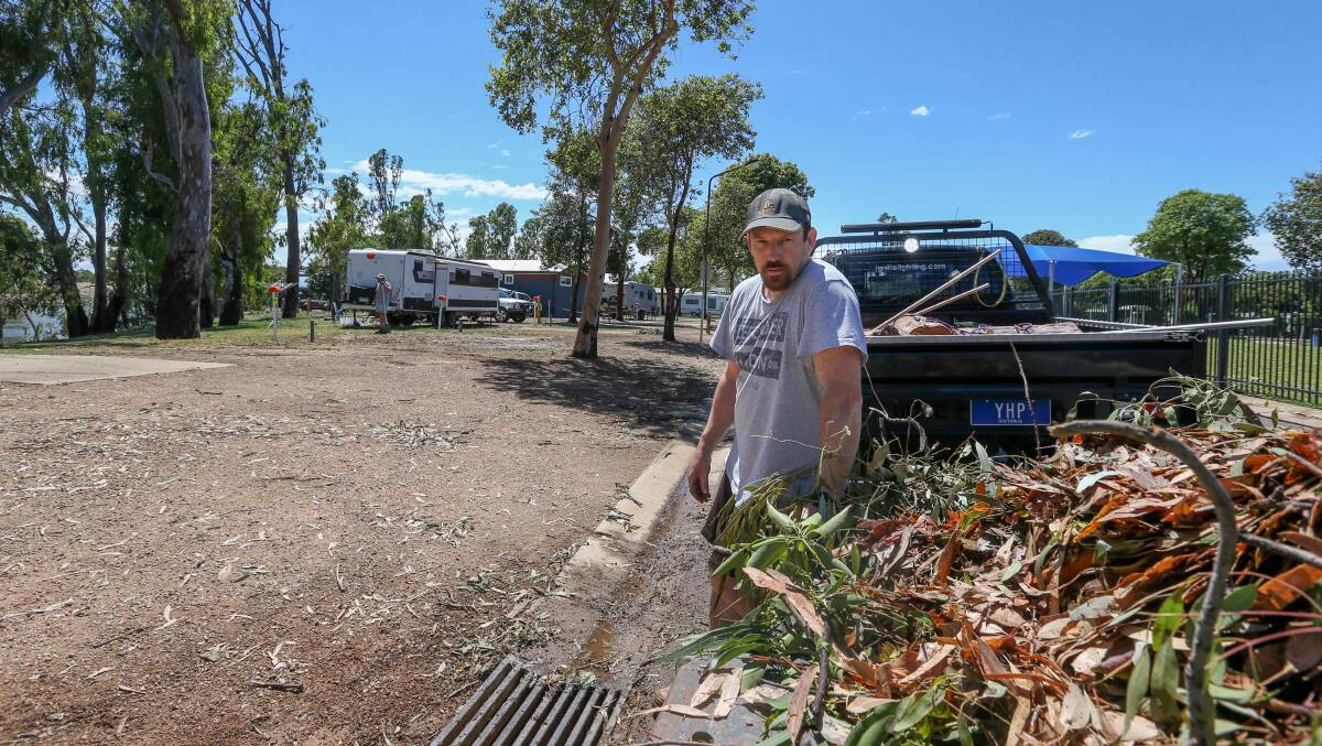 CLEAN UP: Glen Mackie helps clean up the Yarrawonga Holiday Park on Monday. Picture TARA TREWHELLA