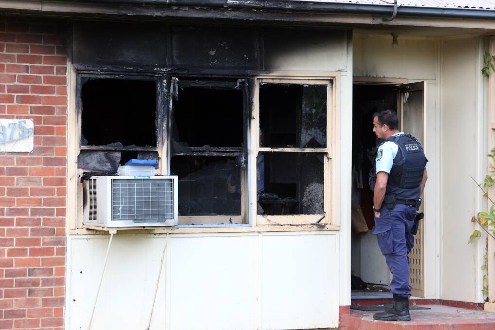 BURNT: Police at the scene of Tuesday's house fire in North Albury. Pictures: BLAIR THOMSON