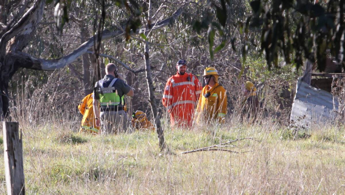 ON SCENE: Emergency service workers are working to free the animal. Picture: BLAIR THOMSON