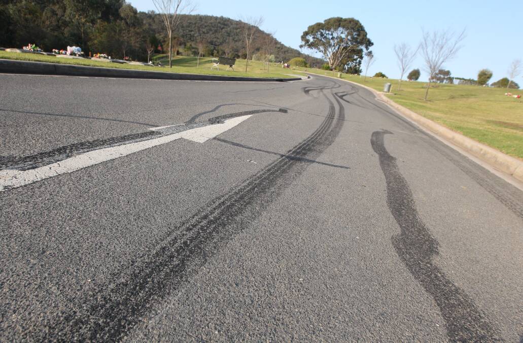 SKID: Tyre marks are left on the road at the cemetery after the teen's funeral. 