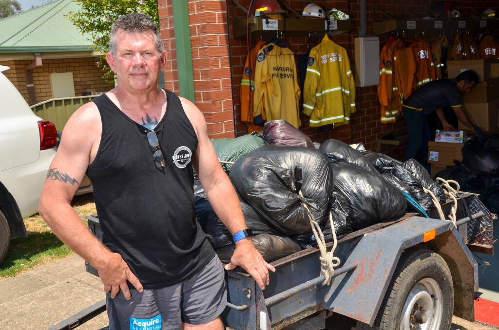 HELPING HAND: The Lavington Rural Fire Brigade has been a hive of activity as people make donations. Andrew Gunn has been delivering goods to those in need. 