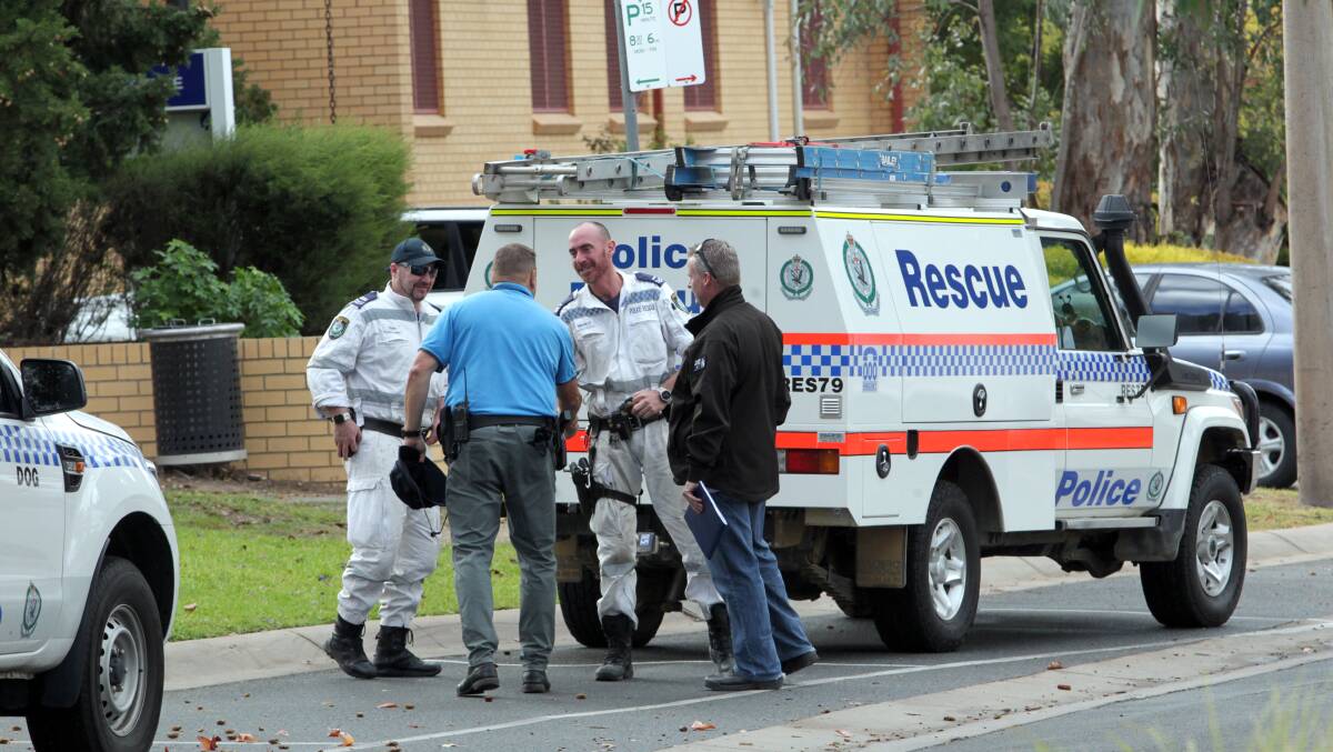 Police searched the nearby area for the dumped gun. A man found the shotgun in bushes outside Albury TAFE, pictured top right, on November 21 last year. 