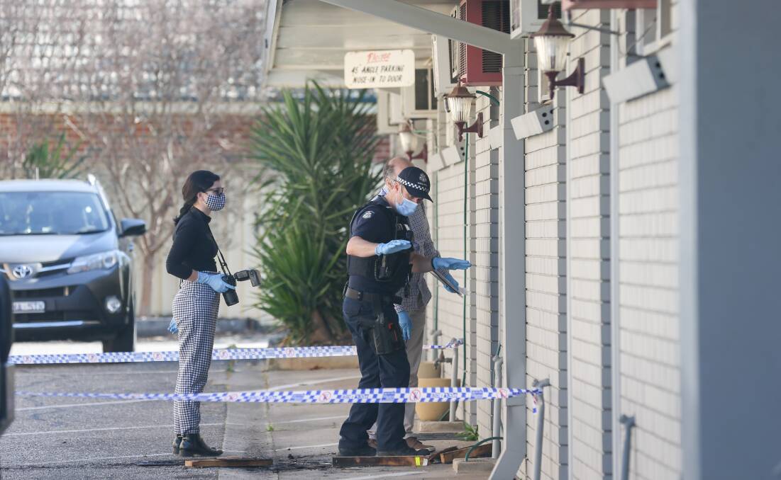 BURNT OUT: Police examine the scene of the fire at the Warrina Motor Inn on High Street last year. The blaze, lit by Felicity Meloury, caused damage worth about $66,000. 