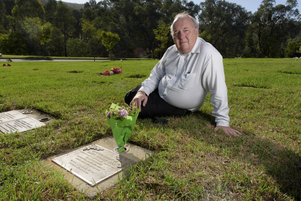 STILL STRUGGLING: Wayne Beer at his father David's grave at the Albury Lawn Cemetery this week. Wayne still thinks about his murdered dad every day and misses his love and the advice he used to give. Picture: SIMON BAYLISS