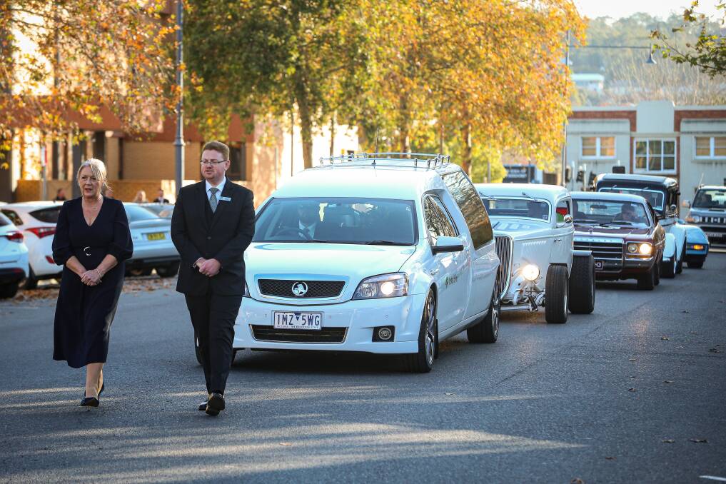 PROCESSION: Hot rods lined Swift Street in Albury as part of a final send off for Jamie Drummond. The father of three and grandfather of eight loved building, designing and driving cars. Picture: JAMES WILTSHIRE