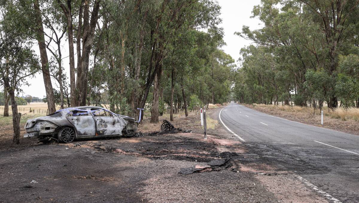 DUMPED AND GUTTED: Police were called to a blaze that destroyed a Mercedes near Barnawartha on Tuesday. The driver fled the scene. Picture: JAMES WILTSHIRE